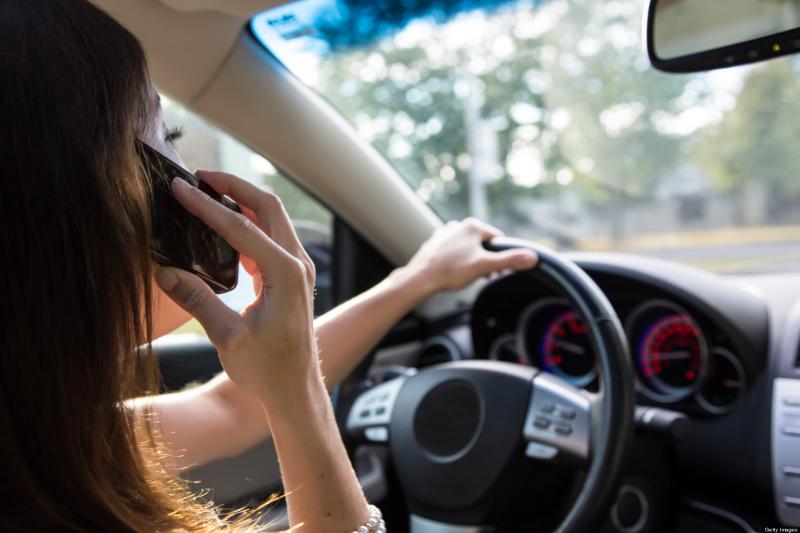 Mobile phone use while driving is illegal.