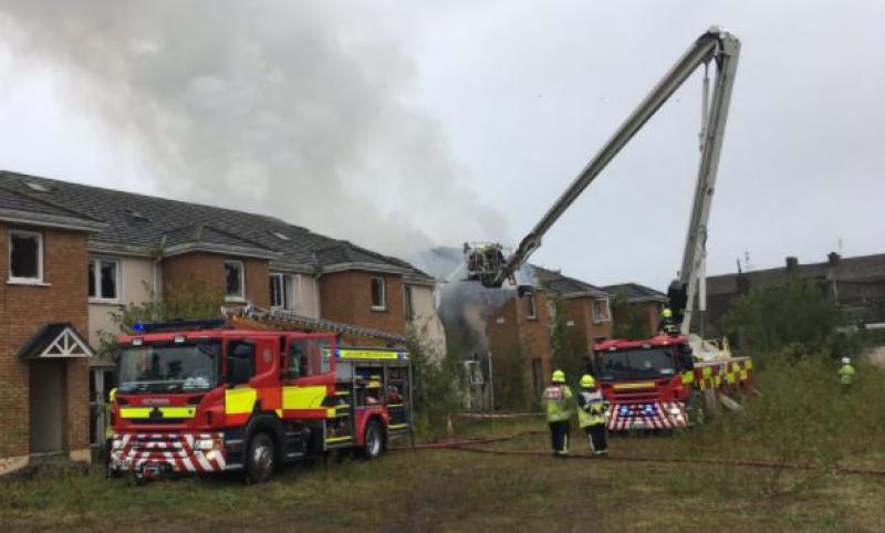 Two apartments "completely burned out" and four "badly damaged" in a fire over the weekend in Laois