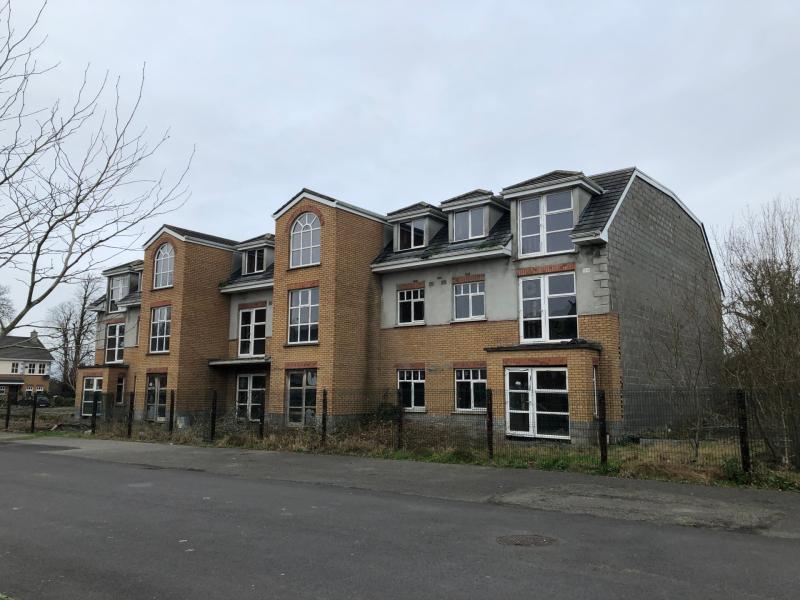 Legal action threat hangs over developer of unfinished Portarlington apartments