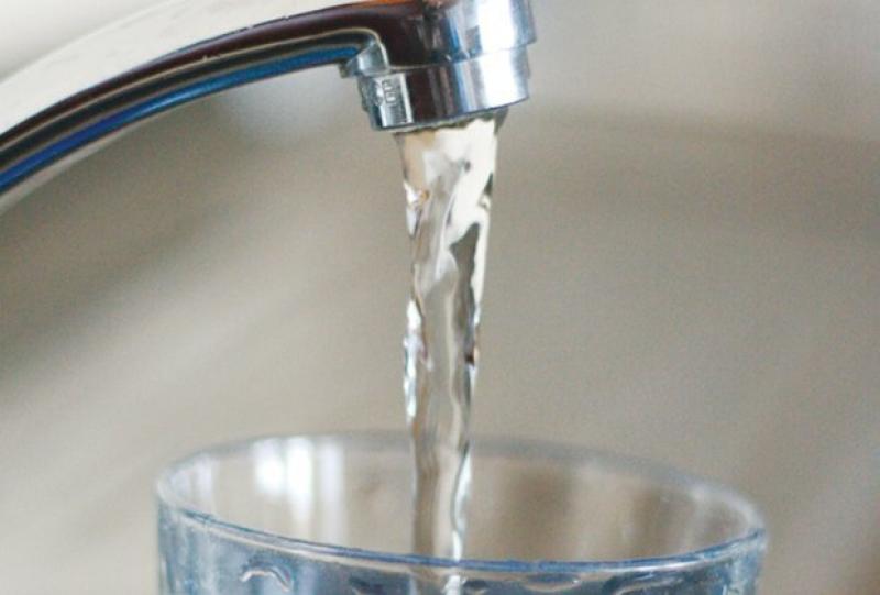 Pictured: File photo of a kitchen tap filling a glass with water
