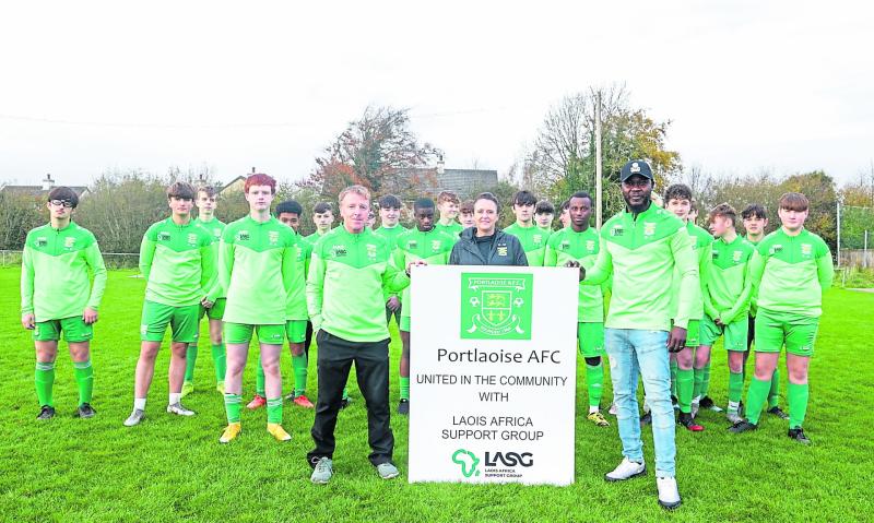 Aengus Burke,  Geraldine Whally and Bolaji Adeyanju along with Portlaoise AFC players last Saturday. 