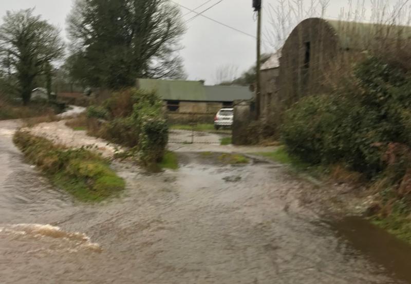 Dangerous road restricts access to water supply when 'submerged' by floods