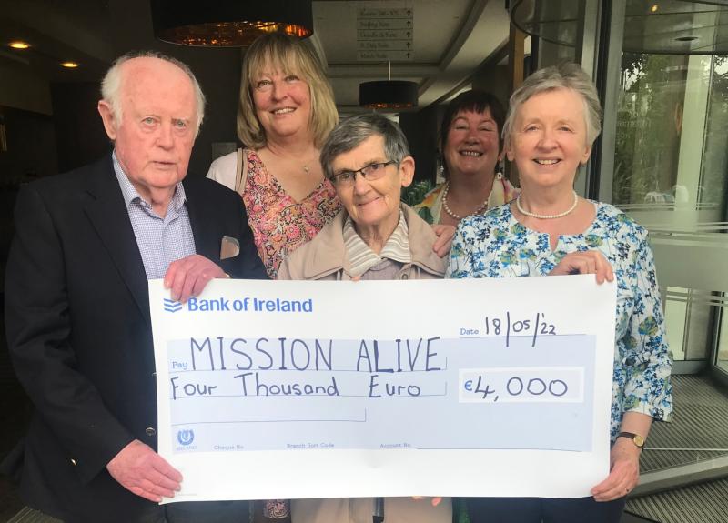 Fr Noel Dunphy, Mary Tracy, Sheelagh Coyle, and Kay Kilroy of Mission Alive making a presentation to Sr Paula, Director of the orphanage in Lusaka.