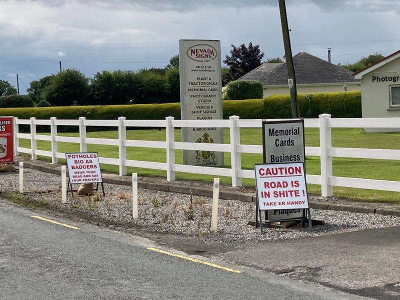 'Caution Road is in Shite'  signs placed in Midlands