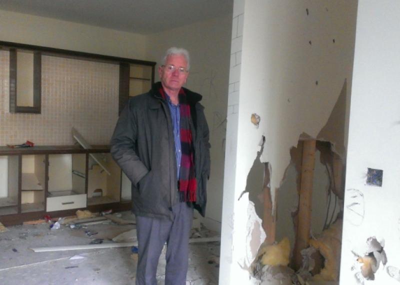 Cllr Aidan Mullins stands in one of a row of badly vandalised empty apartment in Corrig Glen, Portarlington.