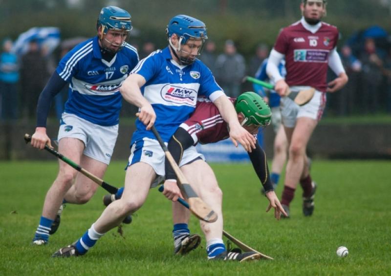 Laois' Brian Campion competes with N.U.I.G's Gerard O'Donohue for this ball in their Walsh Cup clash at Rathdowney on Sunday. Photo Denis Byrne.