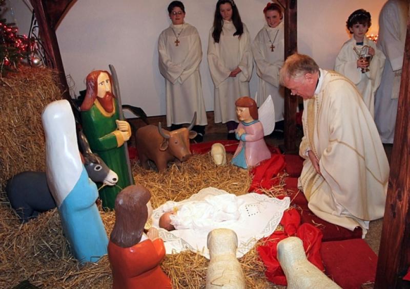 Monsignor John Byrne, PP. Portlaoise blesssing the crib during Midnight Mass in SS Peter and Paul's church Portlaoise on Christmas eve.
