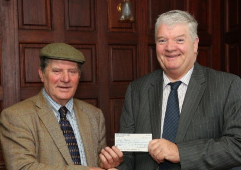 Ken Graham, President of the Irish Steam Preservation Society, Stradbally, presenting a cheque for �1,500 to Seamus O'Donoghue ( Chairman , Laois Hospice Foundation).  Photo: Michael Scully.