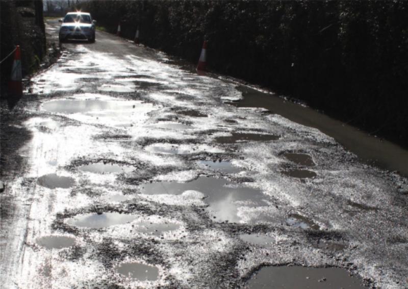 Potholes filling "a waste of money".