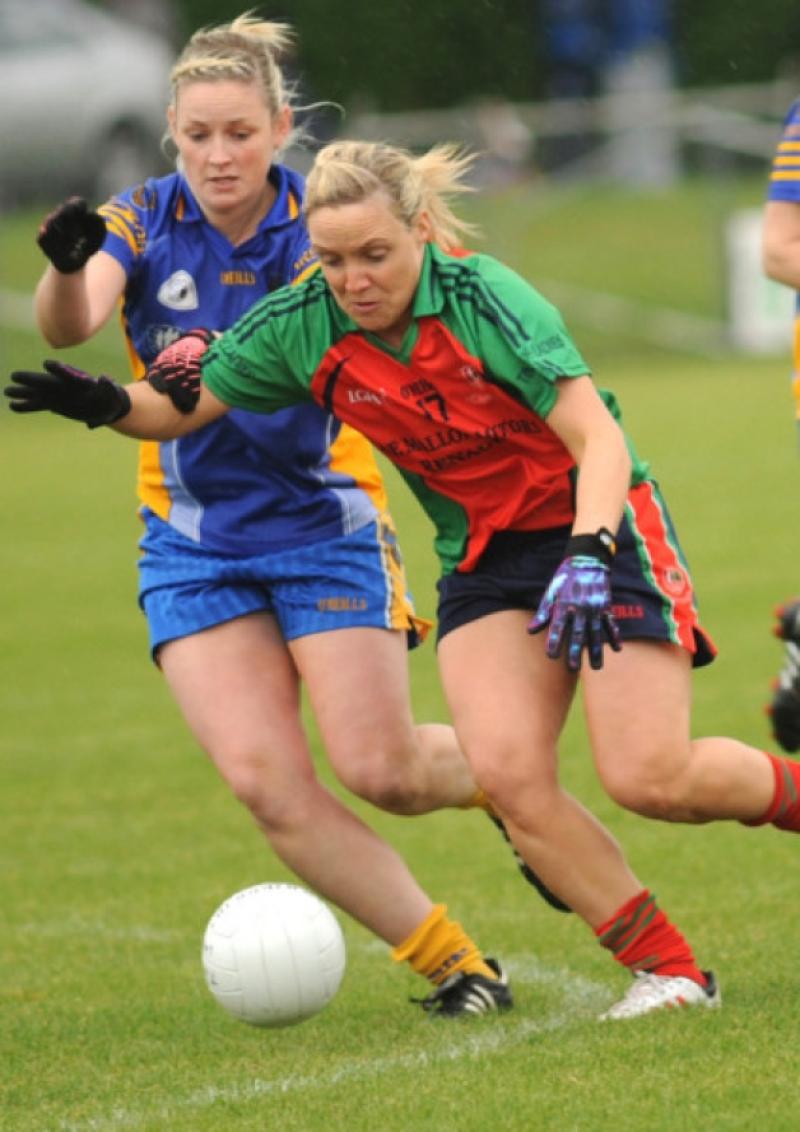 Sarsfields Jenny McEvoy tussles with Timahoe's Gemma O'Connor for this ball.Pic Denis Byrne.