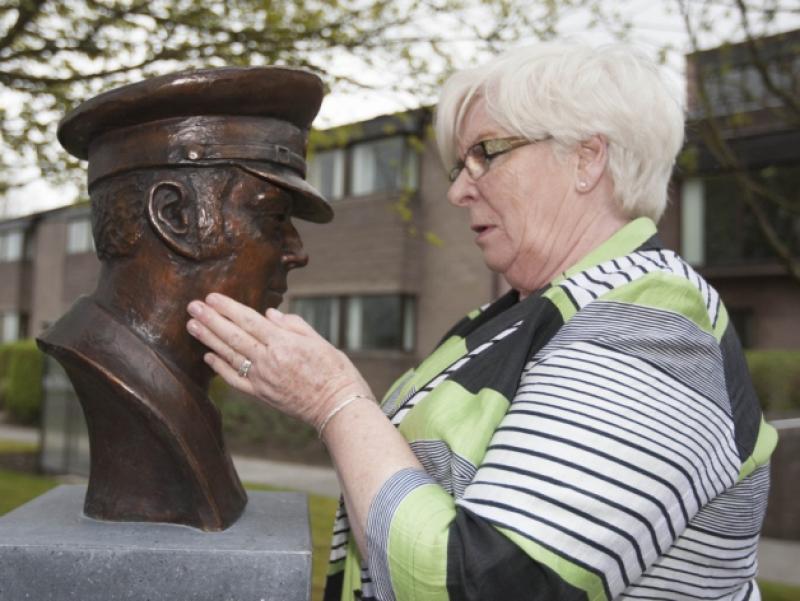 Sheila Stack wife of the late Chief Officer Brian Stack, spends a quiet moment beside his bronze bust, after its unveiling at the Prison Training Centre, Portlaoise by Minister for Justice Equality and Defence Alan Shatter TD. Picture: Alf Harvey