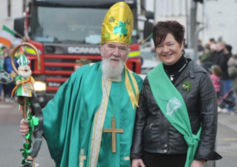 St Patrick and Grand Marshall, Patricia Conroy leading the Mountmellick St. Patrick's Day Parade.                                                  Photo Kevin Byrne