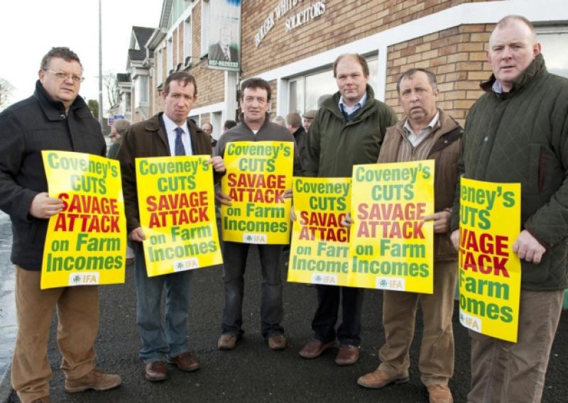 Pictured are Pat Hennessy, Laois I.F.A Chairman, Jer Bergin, South Leinster V.P, Pat Phelan, I.F.A, Henry Burns, Livestock Chairman, Peter Luttrell, Laois I.F.A Vice Chair and Francie Gorman protesting over Budget Cuts to farm schemes outside the constituency office of Fine Gael T.D Charlie Flanagan in Portlaoise yesterday, a number of similar protests have been taking place around the country this week-end.Photo Denis Byrne.