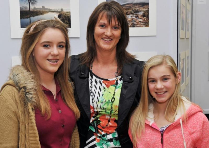 Chloe, Dominica and Meegan Scully enjoying the Mountmellick Camera Club's annual exhibition of photography.                       Photo Kevin Byrne