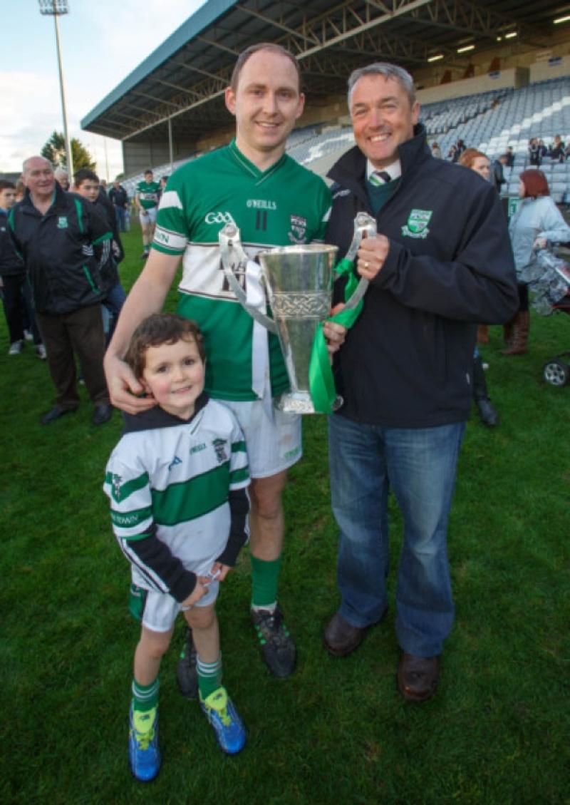 Portlaoise GAA Club Chairman Vincent Dowling with Portlaoise captain Brian McCormack and his son celebrate after defeating Arles Killeen in the Laois Shopping Centre Senior Football final at O'Moore Park. Picture: Jeff Harvey/HR Photo