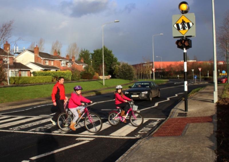 Pat O'Neill with his children Eerin, Orna, Ava making use of the new pedestrian crossing
