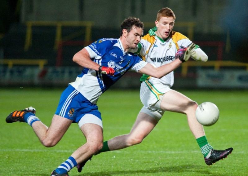 Mountmellicks Colm Coss and Crettyards Evan O'Carroll compete for this ball.Pic Denis Byrne.