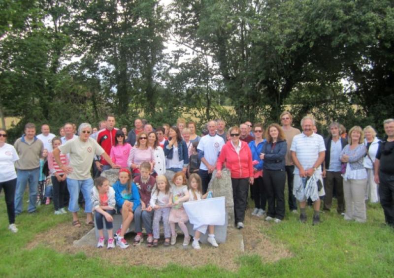 Canal bank walkers gather at the Patrick Kavanagh seat by the canal in Vicarstown.