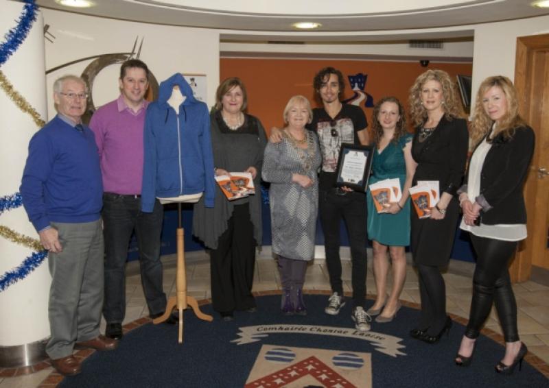 ROBERT SHEEHAN PRESENTS LOVE/HATE HOODIE TO HIS LOCAL ARTS CENTRE: Actor Robert Sheehan returned to his hometown of Portlaoise this Christmas to present the infamous blue hoodie, as featured on his character 'Darren' in Love/Hate to Dunamaise Arts Centre. The blue hoodie will now be framed and displayed as a permanent fixture within the arts centre.The hoodie was presented today to the centre's Manager Michelle de Forge and Chairman Louis Brennan at a private reception where he too was presented with a certificate of his Ambassadorship for the Dunamaise.Picture: Alf Harvey/hrphoto.ie no reproduction fee