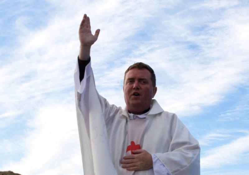 Fr. Paddy Byrne CC celebrates mass at the Burial Ridge Cemetery Millview Portlaoise .