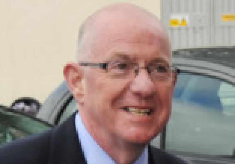 Newly appointed Minister for Children, Charles Flanagan and Taoiseach, Enda Kenny are greeted by Tomas Kontrimas on their arrival to the Laois Shopping Centre on Thursday last.                              Photo Kevin Byrne