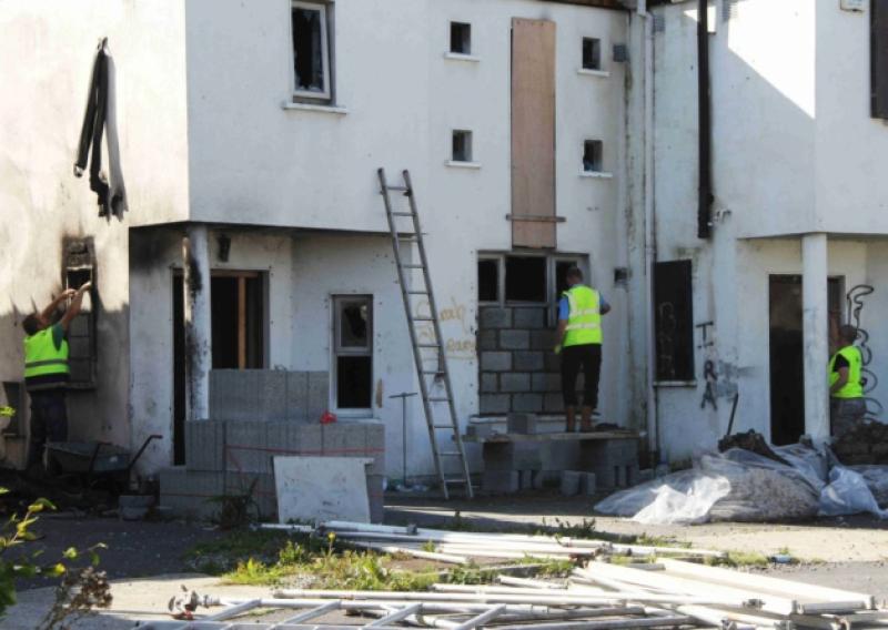 The Sadness of Hepburn Court: Laois County Council contractors blocking up access to some of the surviving structures of what were once dream homes at Hepburn Court, Ballyfin Rd., Portlaoise.