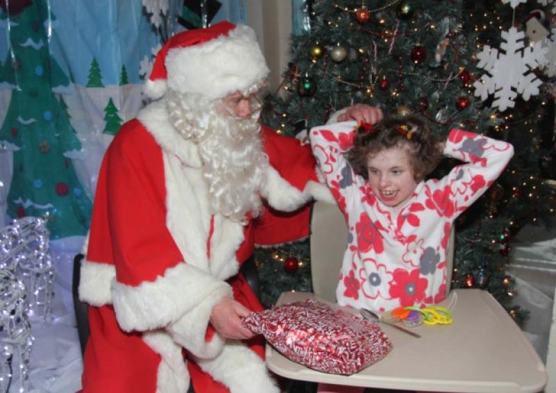 Avery excited Rachel with Santa on his visit to Kolbe Special School, Portlaoise.