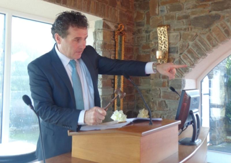 Auctioneer Joe Coogan