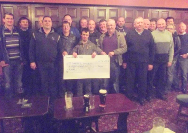 Raheen Vintage Club chairman Tom Dunne presenting a cheque for �700.00 to Laois Down Syndrome association chairman Michael Gorman and his son Eoin.  This is the second year running they have fundraised for LDS.  In the current climate with regard to charities, Laois Down Syndrome would like to assure all our supporters that all monies raised in Laois is used for the direct benefit of our members with disabilities.