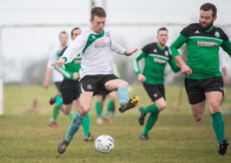 Brian Cleary, Portarlington Town about to change direction on Sunday. Photo Denis Byrne.