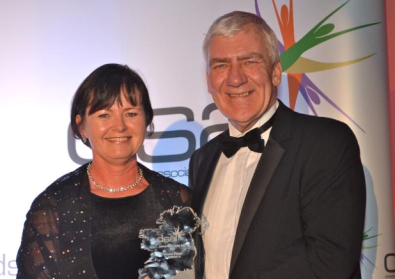 Yvonne Flavin from Oriflame receiving her awar from Peter Sykes, Country Manager of Oriflame. Pic: Tim Vernon, Brio DPM