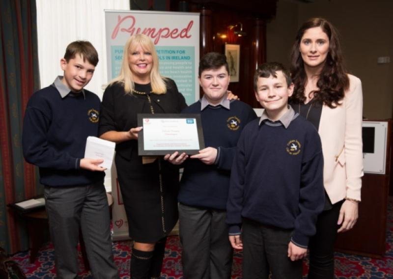 Colaiste Iosagain First Years Luke Melvein, Mark Gray and Conor Slevin with Dr Angie Brown, Consultant Cardiologist and Medical Director of the Irish Heart Foundation and teacher, Carol Browne after finishing second in the National Video Awards Ceremony.