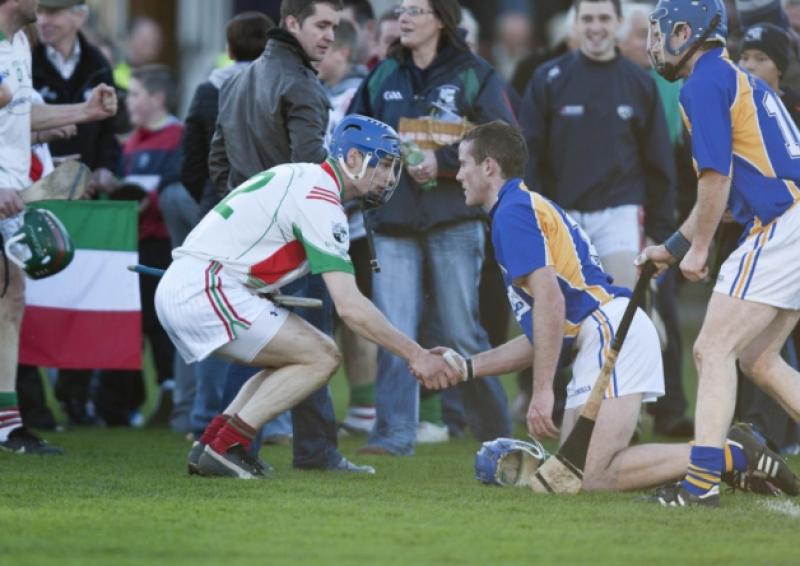 Willie Hyland, Clough Ballacolla is consoled by Brian Campion, Rathdowney Errill after their replayed SHC final at O'Moore Park.Picture: Alf Harvey.