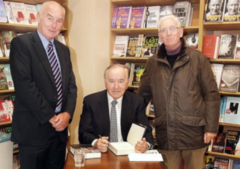 The late former Taoiseach Albert Reynolds signing his autobiography for Cllr  Jerry Lodge and Pat Malone  who were present at the launch at Eason bookstore in Portlaoise in 2009.