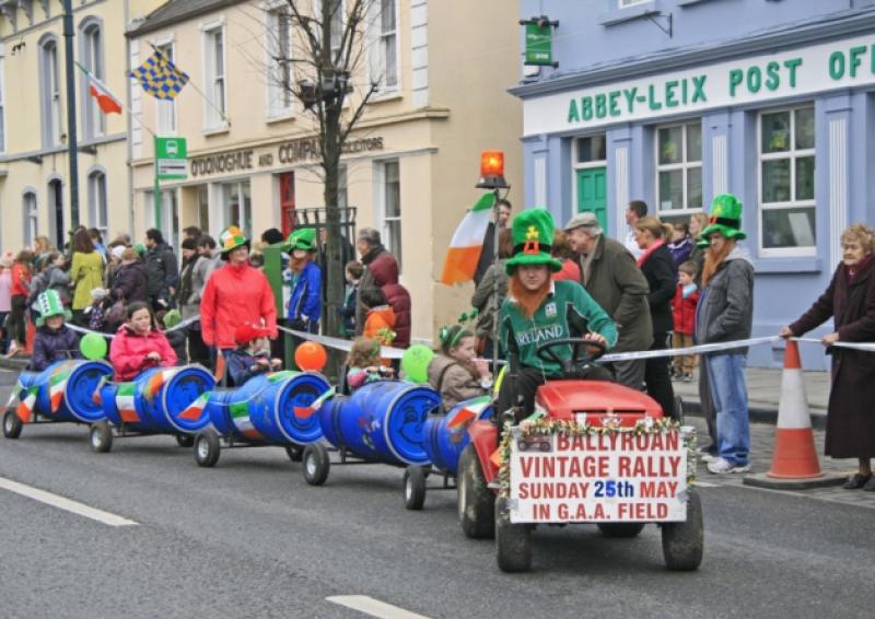 'Leprechaun' Ryan McEvoy drives the Ballyroan 'snake train' while Jean McDonald keeps an eye on the tail!