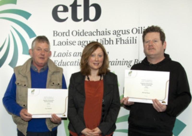 Tony Hartnett and Michael Ryan who received a FETAC Major Award with Kathleen Dunne Adult Literacy Organiser, Portlaoise Adult Education Centre.