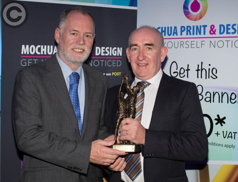 Noel Meredith representing Conor Meredith (O'Dempsey's) is presented with the Intermediate Football Player of the Year by Peter O'Neill. Picture: Alf 